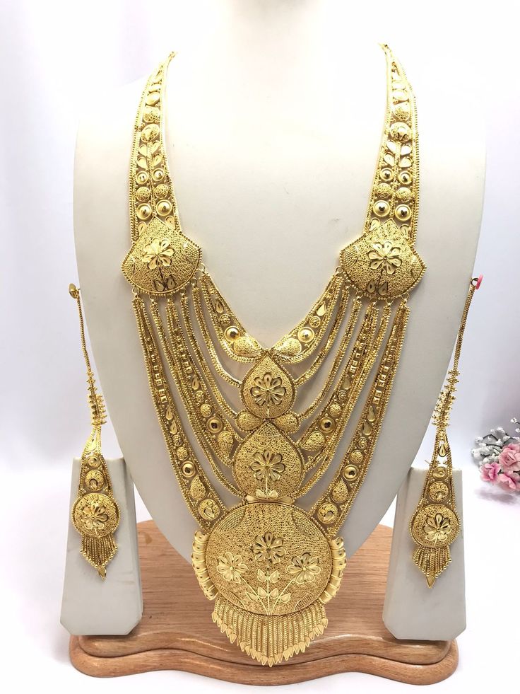 Handmade Indian Jewelry Asian Wedding Bridal Jewellery Party Ethnic Wear 22ct Gold Plated Bridal Necklace Set Rani Haar Bridal Jewellery Set  PLEASE NOTE, This Item Is Not Real Gold .Only Good Quality Gold Plated Jewellery .it is Artificial Jewellery.  It is a perfect match with formal attire on special occasions or with casual wearing.  Slight Colour variations possible due to difference in screen and photograph Care instructions Keep Jewellery away from direct heat, water, perfumes, deodorants Gold Temple Jewelry Tikka For Eid, Gold Kundan Necklace With Cutdana For Eid, Gold Plated Tikka For Festivals, Ceremonial Gold Tikka With Zari Work, Gold Tikka With Zari Work For Puja, Gold Tikka For Wedding And Diwali, Festive Gold-plated Tikka, Gold Wedding Tikka For Diwali, Gold Kundan Necklace Bollywood Style For Eid