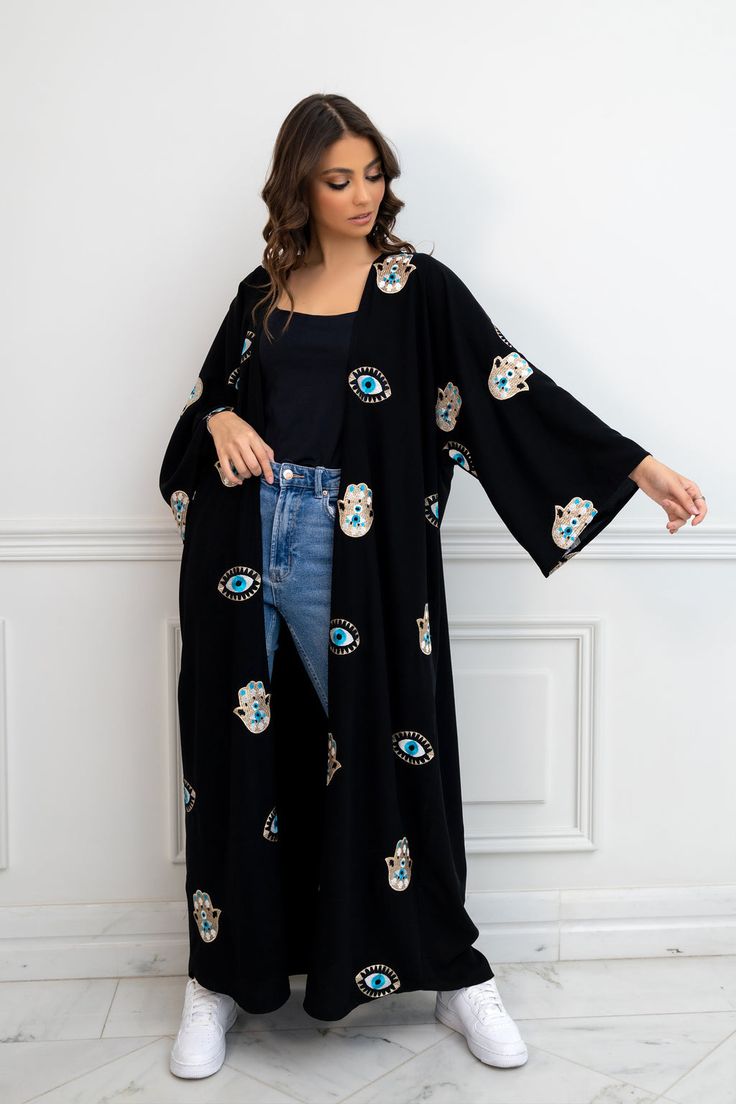 Featuring: Abaya Kimono Evil Eye & Hamsa Hand Embroidery Maxi Length Color: Black.Brand: Unmatched BYU Length: 55... Traditional Black Festive Kimono, Black Bohemian Style Festive Kimono, Festive Black Bohemian Kimono, Festive Bohemian Black Kimono, Festive Black Long Sleeve Kimono, Black Kimono With Floral Embroidery, Festive Embroidered Kimono With Kimono Sleeves, Black Floral Embroidered Kimono, Black Embroidered Long Sleeve Kimono