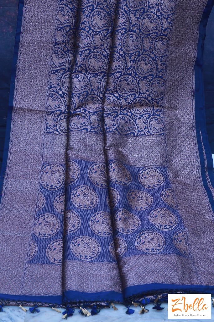 Blue semi soft katan brocade saree with stitched blouse Elegant Blue Pre-draped Saree For Puja, Elegant Blue Chanderi Pre-draped Saree, Elegant Blue Cotton Silk Blouse Piece, Blue Silk Pre-draped Saree For Traditional Ceremonies, Blue Jamawar Pre-draped Saree With Zari Weaving, Blue Katan Silk Pre-draped Saree With Zari Work, Blue Cotton Silk Pre-draped Saree With Zari Weaving, Traditional Blue Pre-draped Saree With Self Design, Royal Blue Art Silk Saree