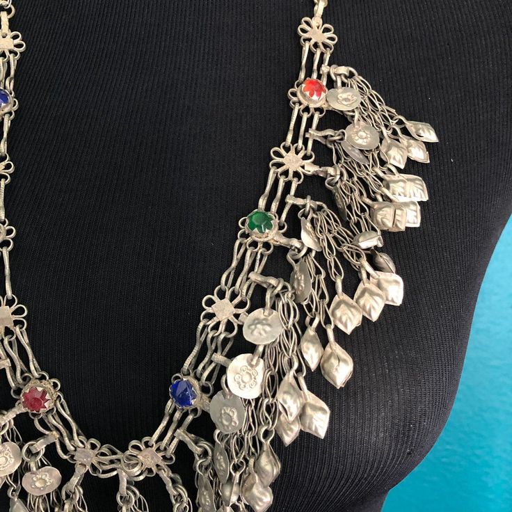 Superb vintage Kuchi necklace with multiple dangling pendants. This is a well loved, worn piece that's in great condition. Slips over the head, no clasp. Dangle Chain Necklace For Festivals, Handmade Vintage Dangle Chain Necklace, Silver Bohemian Dangle Drop Necklace, Silver Bohemian Drop Necklace With Dangle, Metal Necklaces For Vintage Collection, Vintage Pendant Necklaces With Dangling Charms, Vintage Metal Dangle Chain Necklace, Vintage Necklace With Vintage Charm For Festivals, Vintage Necklaces With Vintage Charm For Festival