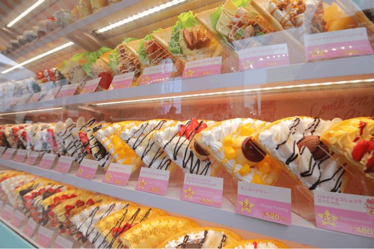 a display case filled with lots of different types of donuts and other pastries