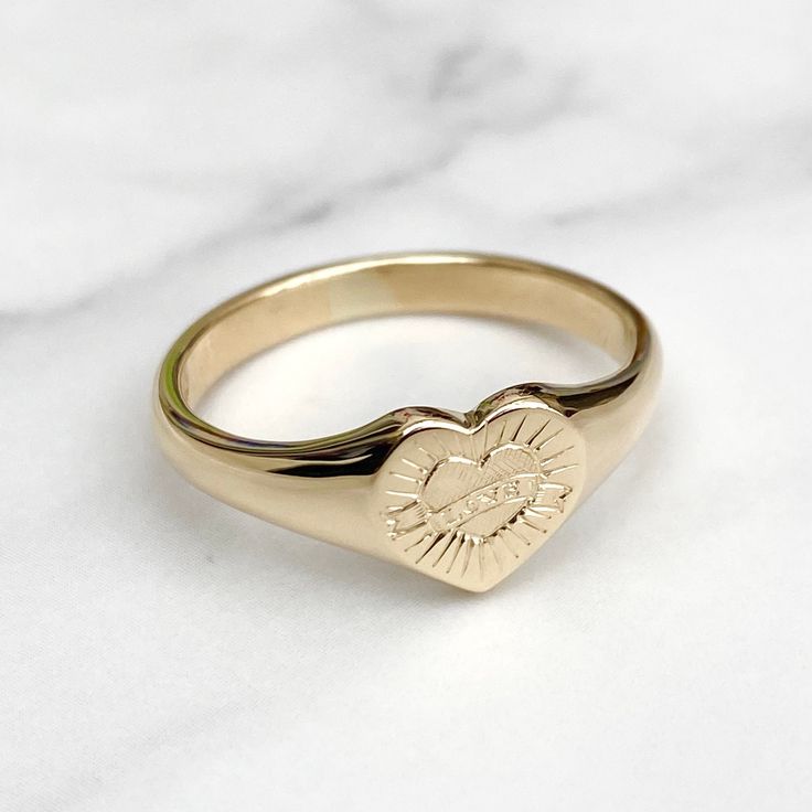 Brand new solid 9ct yellow gold ladies heart signet ring with a unique hand engraved love design  Made to order - 3-4 weeks before being ready to post Ring sizes available - UK - F to U , US 3 to 10 Ring in images is a size T Face size - 8.9mm x 8.9mm  Weight - 4g Size T Hallmarked and highly polished This signet ring comes in a lovely vintage style ring box! Please make contact if you have any questions regarding the item! Follow Heirlooms & Signets on Instagram for the latest updates - https://www.instagram.com/heirloomsandsignets/ Thank You Hannah Gold 14k Stamped Signet Ring For Promise, Gold Oval Signet Ring For Promise, Heart Cut Signet Ring For Anniversary On Valentine's Day, Gold Symbolic Signet Ring For Promise, Classic Heart-shaped Engraved Promise Ring, Heirloom Engraved Heart Ring For Promise, Heirloom Engraved Heart Promise Ring, Classic Heart Cut Signet Ring For Promise, Classic Heart-shaped Signet Ring For Promise