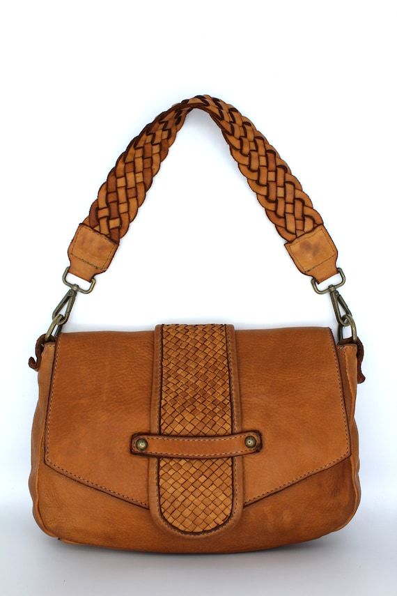 Leather Handbag Size: height 22.5 cm x width 24.5 cm x depth 8 cm.Made in Italy100% high quality Genuine LeatherVisit our store click below 👇 for more leather productshttps://LeatherMilan.etsy.comfor many other leather goods.The bag is beautiful, made with genuine soft natural leather, a unique design and practical to use.Handmade leather bag in Italian soft leather, very practical to use.This bag ages beautifully, the more time passes, the more beautiful the leather becomes.The Leather bag com Leather Satchel Shoulder Bag, Leather Flap Shoulder Bag With Removable Pouch, Leather Hobo Shoulder Bag With Adjustable Strap, Leather Shoulder Bag With Leather Handles, Leather Tote Flap Bag With Adjustable Strap, Leather Crossbody Flap Bag For Daily Use, Brown Leather Satchel Shoulder Bag, Brown Leather Shoulder Bag With Adjustable Strap, Brown Leather Lined Crossbody Shoulder Bag