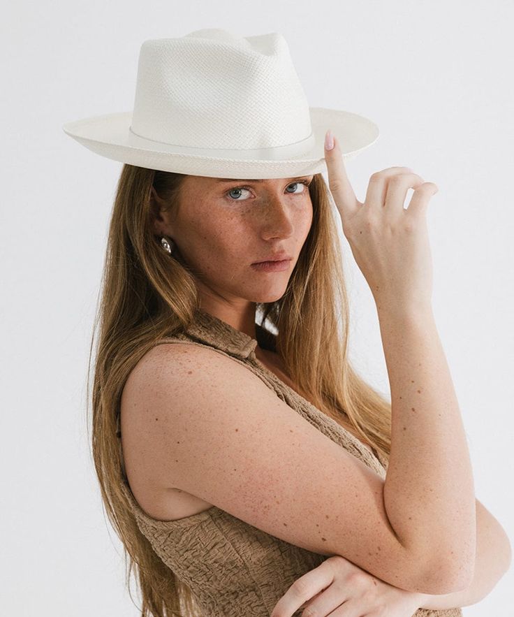 The iconic Panama hat. The Lupe’s short upturned brim combined with a classic fedora crown make it a timeless summer style. This hat includes a genuine leather band with for an elevated accent. Handwoven panama straw is lightweight, making this style an ideal travel companion. Classic Unlined Flat Brim Fedora, Classic Brimmed Unlined Fedora, Modern Fedora With Short Brim For Everyday, Classic Spring Fedora Felt Hat, Chic Adjustable Fedora With Flat Crown, Elegant Wide Brim Fedora For Everyday, Elegant Everyday Brimmed Fedora, Elegant Hats With Short Brim Unlined, Elegant Unlined Hats With Short Brim