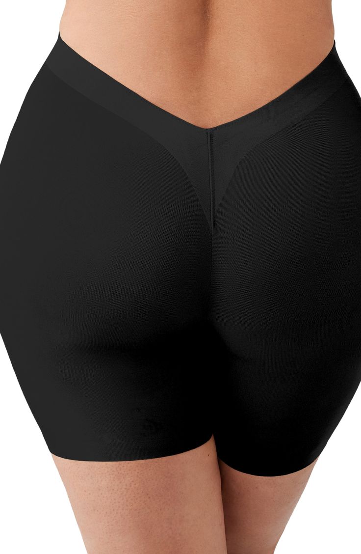 Designed to smooth the thighs, these shaping shorts are cinched at the waist with more room in the hips and bottom to fit and flatter an hourglass figure. Hidden stays keep it from rolling or losing its shape, and the V-back and raw edges keep it smooth and discreet under low-back outfits. 5 1/2" inseam Moderate control Cotton-lined gusset 54% polyamide, 46% spandex Hand wash, dry flat Imported Solid Shapewear With Built-in Shorts, Shapewear Bottoms With Built-in Shorts, Fitted Shorts With Built-in Bra, Mid-thigh Length, Shaping Smoothing Short Bottoms, Solid Color Shorts With Contoured Waistband, Fitted Smoothing Mid-thigh Shorts, Shapewear With Built-in Bra In Short Shape, Solid Shapewear With Built-in Bra, Short Shape, Black Shapewear Bottoms With Built-in Shorts