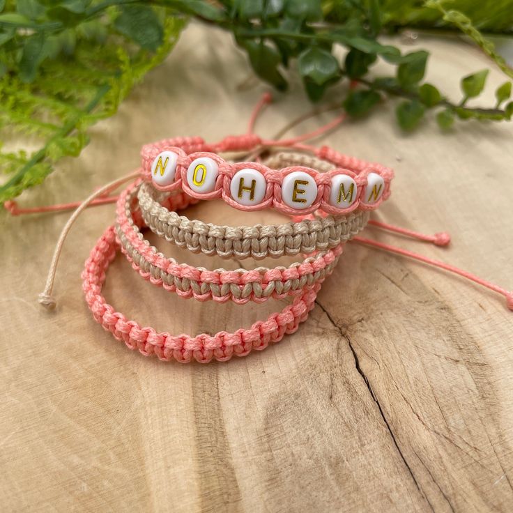 "These macrame bracelets made of the waxed cord are waterproof and adjustable. They are the perfect friendship bracelets. These custom bracelets were designed for everyday wear. This minimalist boho beige and peach cord bracelet enhances your casual outfit. ♥ ITEM DETAILS: Total length: The size of the bracelet is adjustable. 💕The bracelet has an adjustable closure that will work on a wrist of about 6 - 7\"💕 Materials: Waxed cord - Acrylic Initial Charm Charm Color Available: White and Gold Wa Adjustable Casual Friendship Bracelets For Birthday, Bohemian Adjustable Friendship Bracelets For Mother's Day, Adjustable Bohemian Friendship Bracelets For Mother's Day, Everyday Personalized Bohemian Friendship Bracelets, Adjustable Bohemian Friendship Bracelet For Mother's Day, Casual Personalized Braided Bracelets As Gift, Trendy Handmade Friendship Bracelets For Mother's Day, Personalized Pink Bohemian Friendship Bracelets, Handmade Adjustable Name Bracelet For Birthday