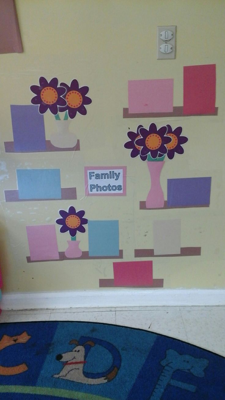 a child's room decorated with flowers and squares