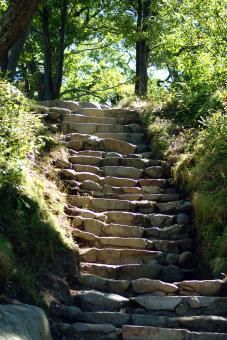 stone steps leading up to the top of a hill