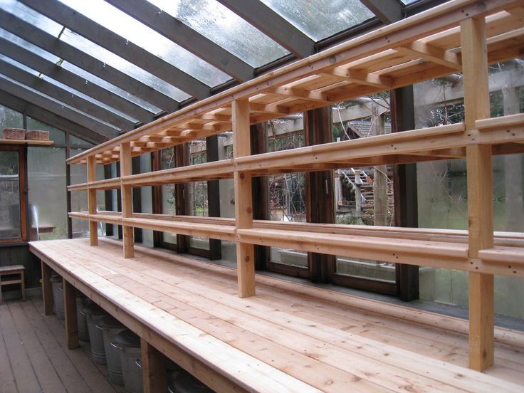 the inside of a building with wooden shelves