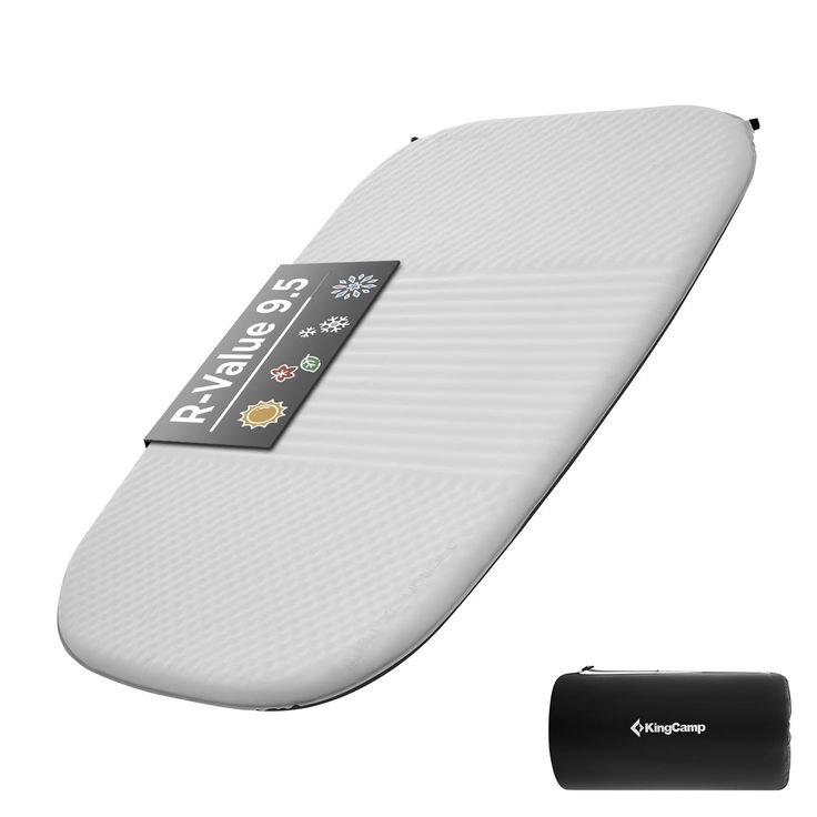 a white surfboard sitting next to a black battery charger on a white background