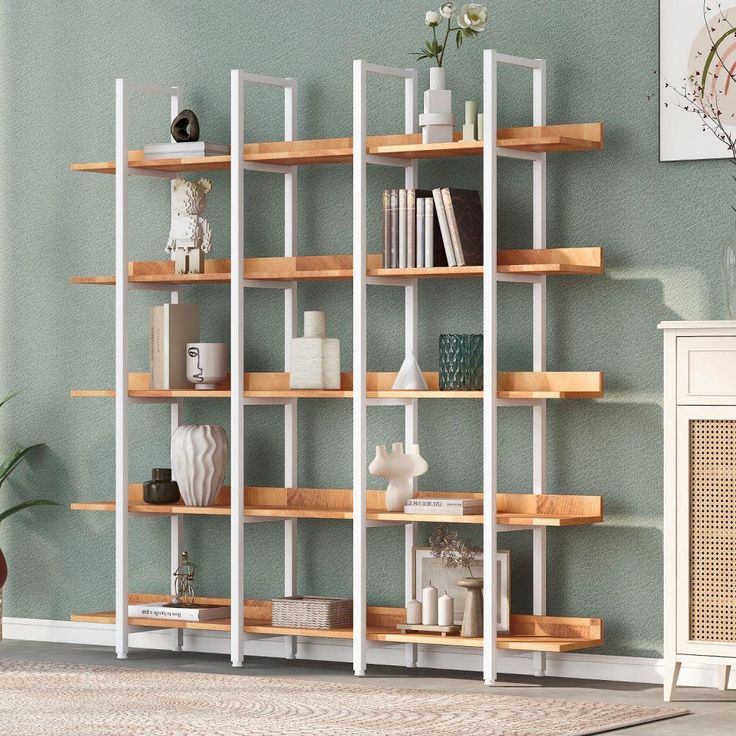 a living room filled with lots of wooden shelves