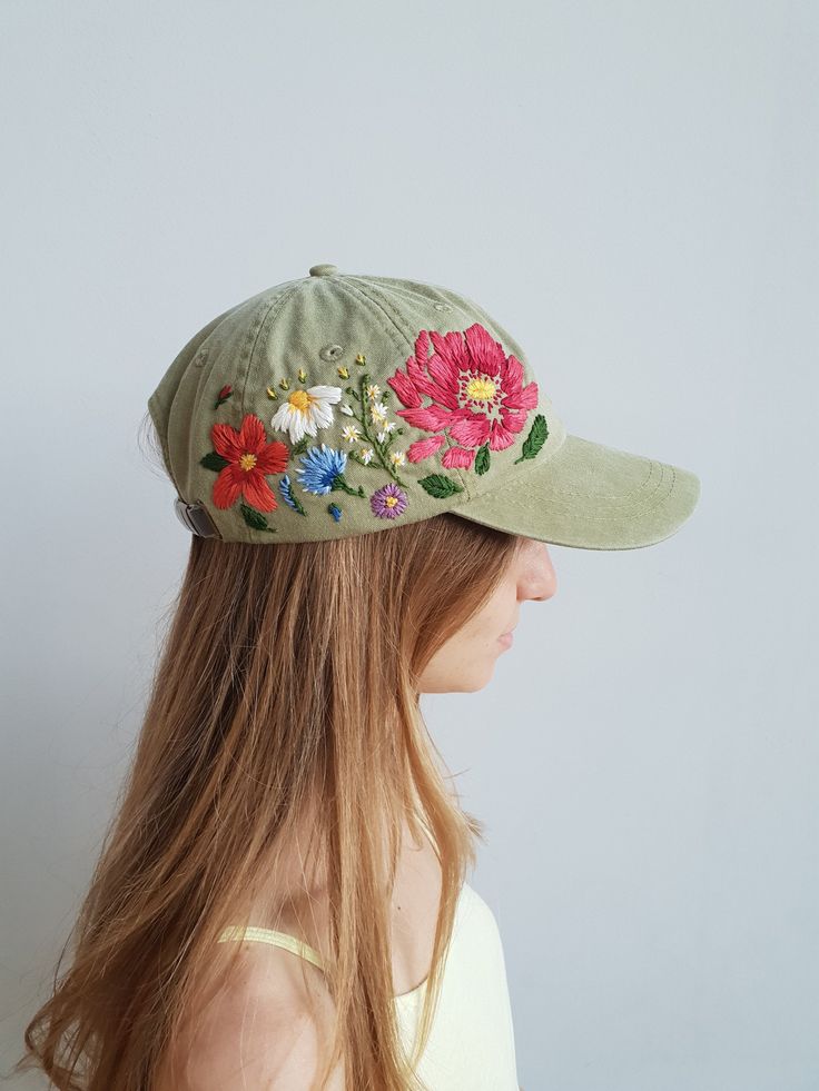 Hand embroidered hiking hat with floral design / baseball hat for women Color: khaki baseball cap. Design: hand-embroidered gerbera with wildflowers. Cap size (head circumference): 55 - 67 cm. The quality of the embroidery and baseball cap is superior, I guarantee! ;) I really enjoyed making this, and I hope my customers will enjoy showing it off. 🌿PLEASE NOTE I NEED 2 WEEKS TO EMBROIDER THIS HAT FOR YOU🌿 CHECK OUR OTHER ACCESSORIES 🌸 More Baseball hats: https://www.etsy.com/shop/KazkovaEmbro Custom Embroidered Hats, Baseball Cap Design, Embroidery Hat, Colorful Hat, Hiking Hat, Custom Baseball Cap, Flower Hat, Hand Embroidery Tutorial, Floral Hat