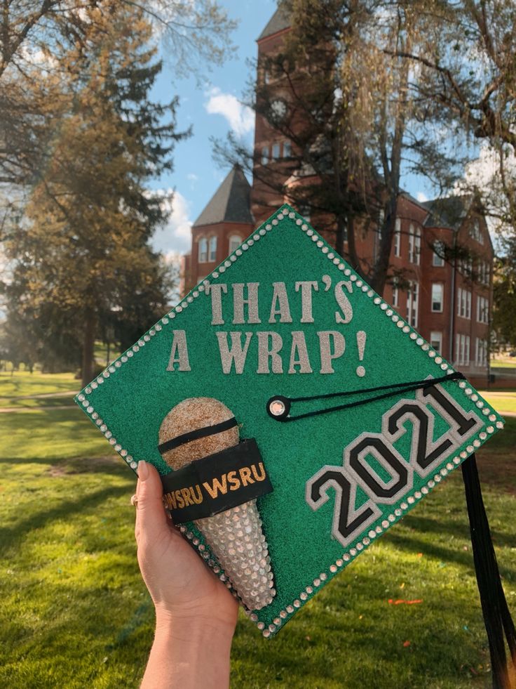 someone is holding up a graduation cap that says, that's a wrap