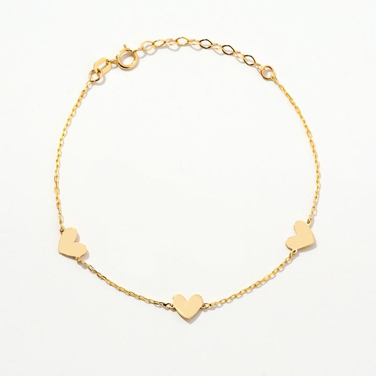 ❧ Product Overview and Key Features  Unique Heart Station Bracelet in 14K Solid Gold, a perfect blend of elegance and love. This bracelet features a series of delicate hearts, making it an ideal gift for anniversaries or just to express your affection. Crafted for women who appreciate timeless jewelry, this 14K gold charm bracelet adds a touch of sophistication to any outfit. A must-have for every jewelry collection. *Material & Color Options: 14k Yellow Gold *Length Options: 5", 5.5", 6", 6.5", Elegant Yellow Gold Heart Bracelet With Beads, Elegant Yellow Gold Heart Beads Bracelet, Yellow Gold Sterling Silver Heart Bracelet For Anniversary, Elegant Yellow Gold Bracelet With Heart Beads, Classic Gold Bracelets For Valentine's Day, Elegant Heart Beads Charm Bracelet For Wedding, Yellow Gold Plated Bracelets For Mother's Day, Tarnish Resistant Heart Bracelet For Anniversary, Mother's Day Yellow Gold Plated Bracelets