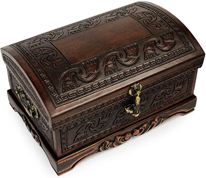 an ornately carved wooden box is shown on a white background with clippings