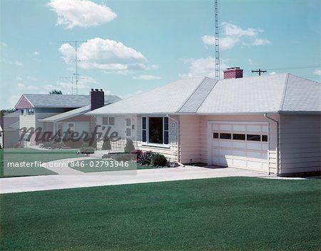 a house with two garages in the front and one on the back of it