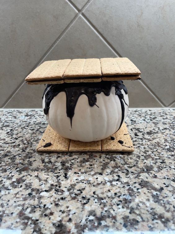 an ice cream sundae sitting on top of a counter next to a tile wall