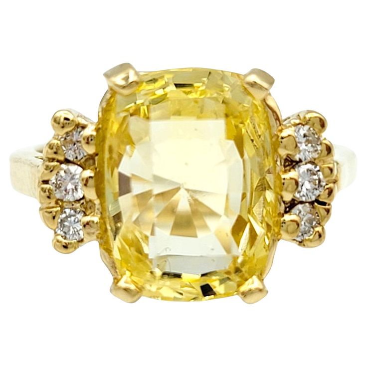 Ring Size: 5.25 Embrace the warmth and radiance of this cushion cut yellow sapphire ring, a true embodiment of elegance in polished yellow gold. The cushion-cut yellow sapphire, resplendent in its sunny hue, sits majestically as the centerpiece, radiating positivity and sophistication. Surrounding the vibrant sapphire are round white diamonds, delicately flanking the main stone on either side. Their brilliance adds a touch of timeless sparkle, creating a captivating contrast against the golden glow of the yellow sapphire. The polished yellow gold setting enhances the overall allure, providing a seamless backdrop that complements the rich tones of the gemstones. This ring is a celebration of both color and brilliance, a perfect harmony of the unique charm of the yellow sapphire and the clas Radiating Positivity, Yellow Sapphire Ring, Yellow Sapphire Rings, Smart Jewelry, Diamond Cocktail Ring, Gold For Sale, Diamond Cocktail Rings, Yellow Gold Setting, Flower Motif