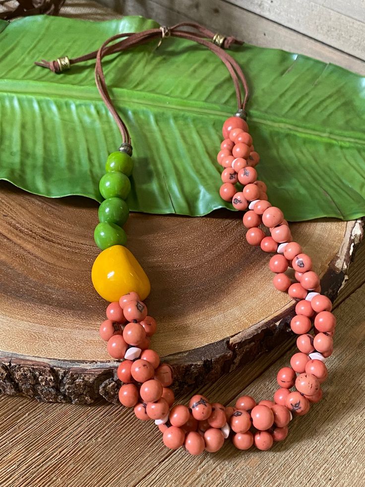 Orange Fair Trade Jewelry Gift, Fair Trade Orange Jewelry Gift, Large Beads Long Necklace For Beach, Unique Orange Necklace With Wooden Beads, Unique Orange Jewelry With Wooden Beads, Beach-style Long Necklace With Large Beads, Beach Jewelry: Long Necklace With Large Beads, Long Beach Necklace With Large Beads, Orange Wooden Beads For Jewelry Making