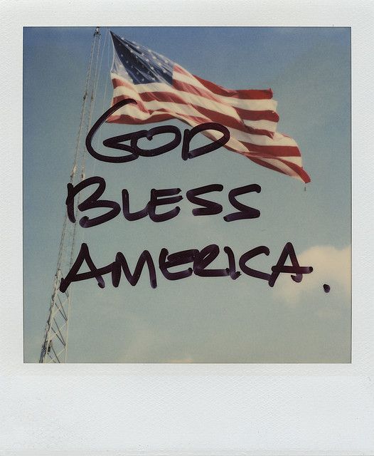 an american flag with the words god, bees, america written in black on it