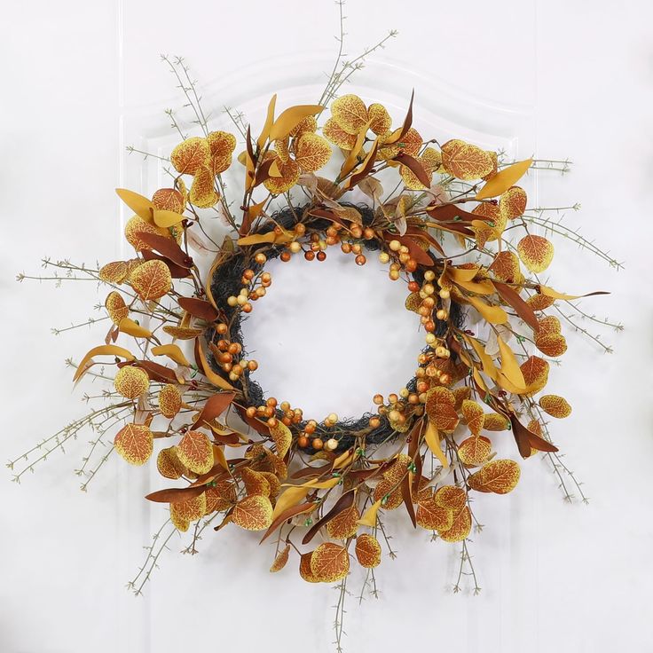 a wreath made out of dried flowers and twigs