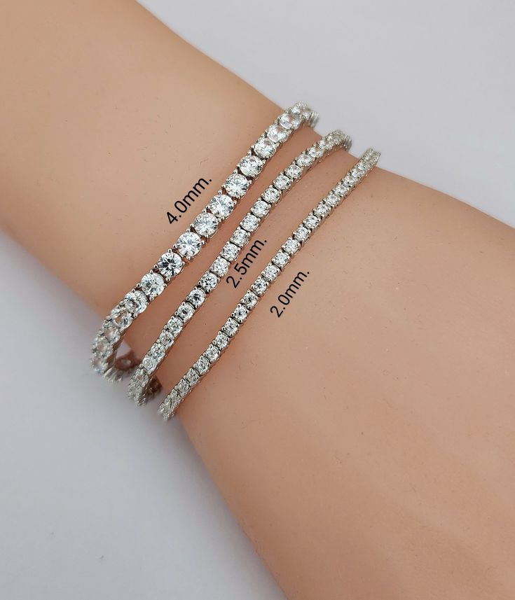 "925 Sterling Silver Cubic Zirconia Tennis Bracelet Real 925 Sterling Silver NOT SILVER PLATED High Quality Silver Bracelet   High polished rhodium finish gives this bracelet a stunning shiny look that lasts many years. We have hundreds Silver Jewelry in stock. If you don't see what you are looking , feel free to ask us.   Trendy, dainty, luxurious, classic with modern touch, elegant and fancy, fine quality made   925 Sterling Silver Tennis Bracelet Description 925 Sterling Silver Tennis Bracelet Metal Type:  925 Sterling Silver ( Not Plated ) Fine Quality Cubic Zirconia Width & Length:  Width 2.0mm.  Length 6.5\" - 7\"   3.00ct.  tw. diamond size Width 2.5mm.  Length 6.5\" - 7\"   4.00ct.   tw. diamond size Width 4.0mm.  Length 6.5\" - 7\"   8.00ct.  tw. diamond size Setting Type: Pong Se Silver Tennis Bracelet As Gift, Silver Bracelet With Brilliant Cut For Gift, Silver Brilliant Cut Bracelet As Gift, Silver Brilliant Cut Bracelet For Gift, Silver Tennis Bracelet With Round Cut For Gift, Silver Brilliant Cut Tennis Bracelet As Gift, Silver Brilliant Cut Tennis Bracelet Gift, Silver Tennis Bracelet With Round Cut Stones As Gift, Silver Crystal Tennis Bracelet As Gift