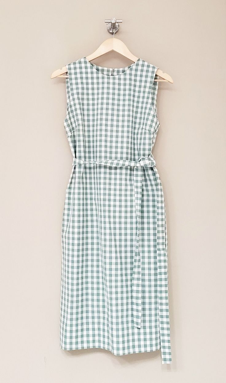 "Gingham sleeveless Dress / Handmade by littleflowerfabric / 100% Cotton Dress / Lightweight / Pullover / Handmade STYLE * Fits neatly across the shoulders. * Gentle, shape that floats subtly away from the body. * No zipper, pullover. * Right above bust including armhole up to neckline is lined with the same fabric as blouse for fit. DETAILS * Made with Cotton 100%, 140 gsm * Manufacturer: Fableism Supply Company * Collection: Camp Gingham PLEASE NOTE * Made to order. Hand made. Neither returnable nor exchangeable. * All garments are approximate as to be expected with the handmade. PLEASE CHECK * The measurements carefully. (Especially the body BUST measurements) The most important thing is the measurement of the bust size. FIT * Order your usual size. * Model wears Small size / Model 5' 5 Chic Cotton Sleeveless Dress For Garden Party, Fitted Casual Sleeveless Dress For Picnic, Chic Gingham Cotton Dresses, Cotton Sleeveless Sundress For Garden Party, Green Cotton Sleeveless Dress For Spring, Vintage Sleeveless Dress For Picnic, Fitted Sleeveless Dresses For Picnic, Gingham Sleeveless Dress For Picnic, Gingham Cotton Dresses For Day Out