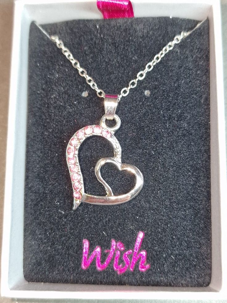 Heart necklace Inset glass stones Pendant 20mm across On trace chain Comes in Wish Jewellery presentation box Brass or zinc alloy base with rhodium plating : Please note, all items that are brass/'plated', may tarnish. Pink Alloy Necklaces For Valentine's Day, Double Heart Silver Stainless Steel Necklace, Pink Alloy Jewelry Gift, Silver Heart Pendant Necklace In Alloy, Silver Stainless Steel Necklace For Valentine's Day, Nickel-free Heart-shaped Alloy Jewelry, Nickel-free Heart Shaped Alloy Jewelry, Alloy Charm Necklaces For Mother's Day Gift, Mother's Day Alloy Charm Necklaces As Gifts