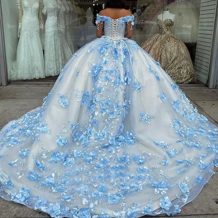 Details: Silhouette: Ball Gown Style Fabric: Tulle Fabric Color: Sky Blue Color Length: Chapel Train Neckline: Off the Shoulder Neckline Sleeves: Sleeveless Back: Corset Back Embellishment: Appliqued Quinceanera Dresses Princess, Sky Blue Quinceanera Dresses, Blue Quinceanera Dresses, Blue Quinceanera, Off Shoulder Ball Gown, 15 Birthday, Quinceanera Dresses Blue, Random Clothes, One Shoulder Prom Dress