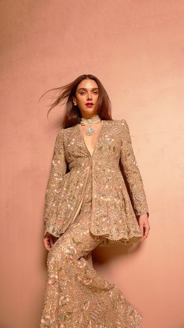 Jayanti Reddy on Instagram: "Our quintessential muse @aditiraohydari graces us in a hand-embroidered peplum and sharara, resplendent in gold sequins and intricate threadwork. A masterpiece of craftsmanship, meticulous detail, culminating in a timeless and dreamy finish.  #JayantiReddyCouture" Sharara New Designs, Peplum Indian Outfit, Peplum Suits Indian, Aditiraohydari Dress, Party Wear Indian Dresses Receptions, Indo Western Party Wear Women, Indian Dresses To Wear To A Wedding, Outfit For Indian Wedding, Latest Indo Western Outfits For Women