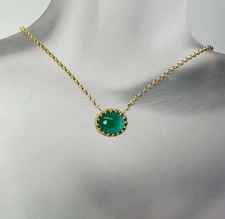 Cabochon Cut Oval Shape Natural Green Emerald  The gemstone weighs 3.20 carat and measures 10.5x9x5mm  It is set in a 14 karat yellow gold ornamental center frame of a necklace.  The rolo design chain weighs 1.4 grams and it is 10 karat yellow gold with a spring ring clasp. Yellow Gold Oval Cabochon Gemstones, Elegant Gold Cabochon Gemstones, Luxury Gold Oval Cabochon Gemstones, Elegant Yellow Gold Jewelry With Cabochon, Elegant Yellow Gold Cabochon Jewelry, Elegant Green Cabochons As Gifts, Elegant Green Cabochons For Gifts, Classic Yellow Gold Necklaces With Cabochon, Gold Cabochon Gemstones For Formal Occasions