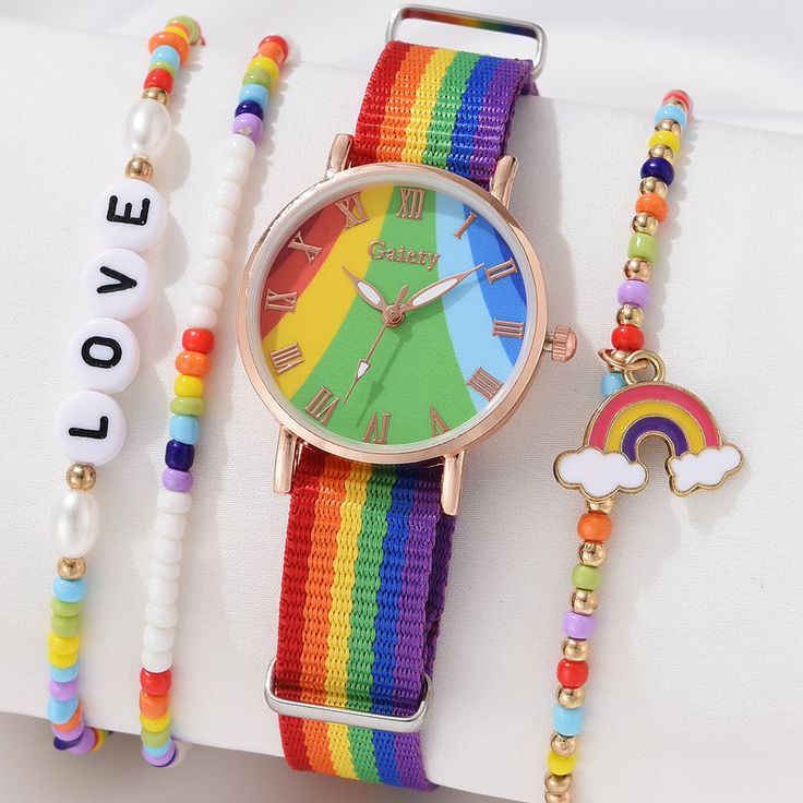 Introducing Our Stylish Rainbow Quartz Wristwatch for Women Step into a world of elegance and style with our Fashion Rainbow Quartz Women's Wristwatch. Crafted with precision and designed to elevate your look, this stunning timepiece is the epitome of sophistication. With a vibrant rainbow-colored fabric belt, this watch adds a pop of color to any outfit, making it perfect for both casual and formal occasions. The quartz movement ensures accurate timekeeping, so you'll never miss a beat. Key Fea Multicolor Analog Watches As Gift, Multicolor Analog Watches For Gift, Gift Multicolor Analog Watches, Trendy Multicolor Watches As Gifts, Trendy Multicolor Quartz Watches, Watches With Bracelet Strap And Round Dial, Fashion Watch With Bracelet Strap And Round Dial, Watch With Bracelet Strap And Round Dial, Wristwatch Fashion