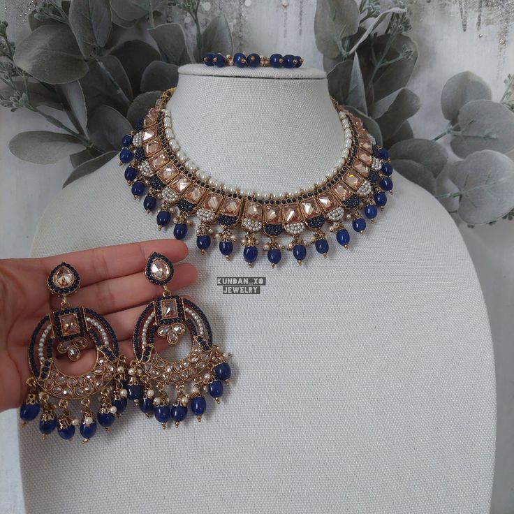 Regal and timeless antique gold reverse polki modern Indian jewelry set done in a  sabyasachi inspired design with NAVY BLUE accent beading is available for purchase. Full set comes with easy to wear long chandelier earrings, tikka and necklace for countless wears!  DRAWSTRING closure for a custom fitted neckline. The perfect hand crafted jewelry is sure to compliment your next outfit this season and next! Wear the pieces together or seperately for endless options. Our beautiful Indo-western des Modern Indian Jewelry, Gold Tikka, Indian Jewelry Set, Sabyasachi Jewelry, Long Chandelier, Sabyasachi Jewellery, Outfits Woman, Blue Accent, Indian Jewelry Sets