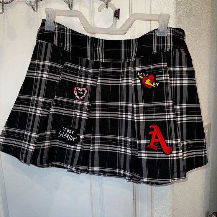 Cuteee Plaid Skirt!!! Brand New! (Tags Attached) Black/White With Patches. No Shorts Underneath. Size Xxl (19) Walmart Brand. Minimal To No Stretch. Zipper On The Side. Edgy Mini Skirt For School, Edgy Mini Skirt Bottoms For School, Punk Style Cotton Mini Skirt, Retro High Waisted Black Mini Skirt, Retro High Waist Black Mini Skirt, Retro High-waisted Black Mini Skirt, Edgy Pleated Skirt For School, Trendy Skirted Bottoms For School, Retro Black Mini Skirt