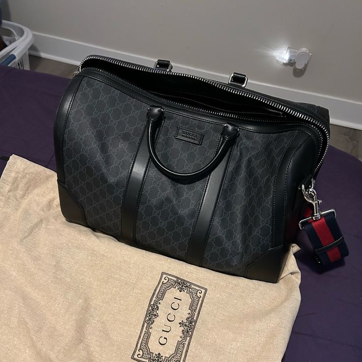 Never Used But No Tags. Comes With Gucci Cloth. Designer Duffle Bag For Shopping, Designer Top Handle Duffle Bag For Shopping, Designer Top Handle Duffle Bag With Dust Bag, Designer Travel Bag With Top Carry Handle, Luxury Duffle Bag For Shopping, Designer Everyday Duffle Bag, Designer Duffle Bag For Everyday Use, Designer Travel Duffle Bag, Designer Black Duffle Bag For Shopping