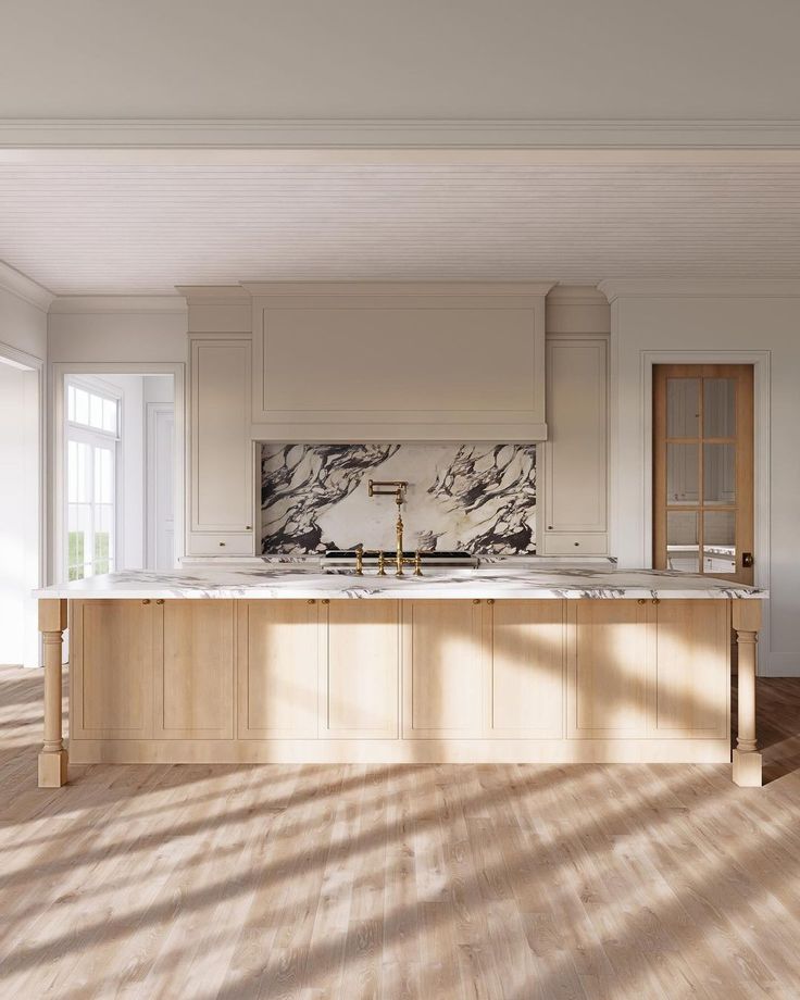 an empty kitchen with marble counter tops and wooden floors