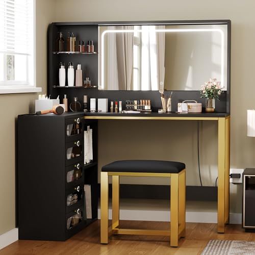 a vanity with a mirror and stool in a room