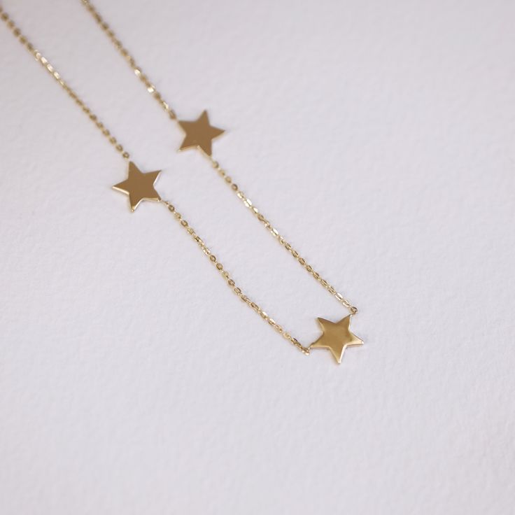 "Star Charm Necklace, 5 Star Charm Choker, 14k Gold Star Charm Necklace, Star Pendant Necklace, Layering Necklace, 14k Gold Star Choker ≫ Product Details ◈ Handmade / Handcrafted Fine Jewelry ◈ Star Charm Size: approximately 6.80mm ◈ Metal: Solid 14K Gold ◈ Gold Color: 14K Solid Gold (18K also available - Additional fees may apply) ◈ Chain Length: 13\" ~ 18\" ≫ Please read our FAQ below for more detail." Celestial Star-shaped Yellow Gold Necklace, Celestial Star Yellow Gold Necklace, Celestial Yellow Gold Star Necklace, 14k Gold Star Jewelry, 14k White Gold Star Necklace, 14k Gold Star-shaped Necklace For Anniversary, 14k Yellow Gold Necklaces With Star Charm, Celestial 14k Gold Necklace With Star Charm, 14k Yellow Gold Necklace With Star Charm