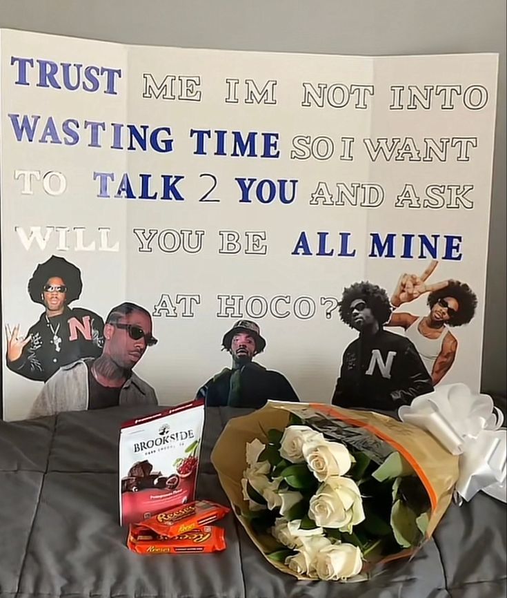 there is a bouquet of flowers on the bed next to a sign that says trust me i'm not into waiting time so want to talk 2 you and ask will you be all mine