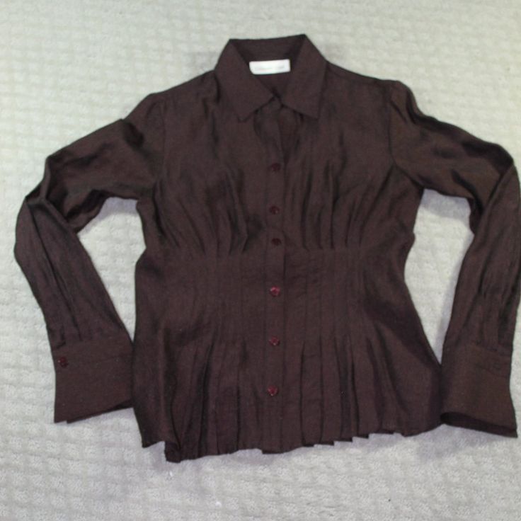 New Never Worn Cold Water Creek Button Up Top With A Ruched Front That Gives A Ruffled Bottom Illusion. Slightly Sheer With Almost A Metallic Sheen. The Cut Of This Top Is Fitted. It Is A Dark Chocolate Brown, Very Beautiful Color. New Without Tags Size: Petite Xsmall. Happy To Answer Questions, Bundle With Other Items To Save On Shipping And Take Reasonable Offers. New To Poshmark? Enter Code Style_exchange During Sign-Up To Get $10 Off Your First Order! The Actual Color Of The Item May Vary Sl Fitted V-neck Shirt With Button Cuffs, Fitted V-neck Shirt With Button Closure, Fitted Shirt With Buttons For Daywear, Collared Office Tops With Covered Buttons, Brown Tops With Button Closure For Daywear, Brown Formal Top With Button Cuffs, Fitted Button-up Top With Button Cuffs, Formal Brown Top With Button Cuffs, Formal Brown Tops With Button Cuffs