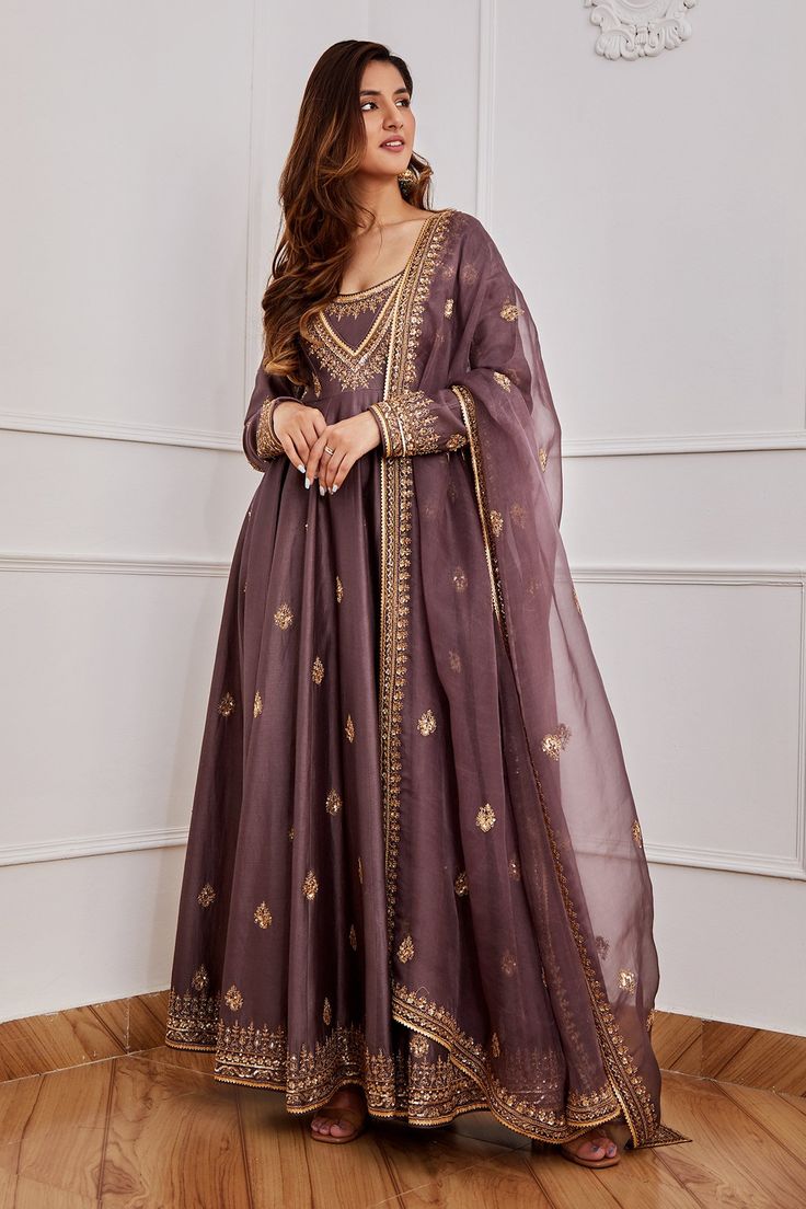 Dark purple anarkali with gold dori, aari and sequin embroidery. Comes with churidar and dupatta.
Component: 3
Pattern: Embroidery
Type Of Work: Sequin, Dori and Aari
Neckline: U neck
Sleeve Type: Full
Fabric: Chanderi, Organza and Cotton Silk; Lining: Shantoon
Color: Purple
Other Details: 
Dupatta with embroidered border
Occasion: Wedding - Aza Fashions Grand Anarkali Dress, Purple Pakistani Suit, Purple Pakistani Dress, Jigar Mali, Purple Anarkali, Chanderi Anarkali, Silk Anarkali Suits, Desi Outfits, Lehenga Designs Simple