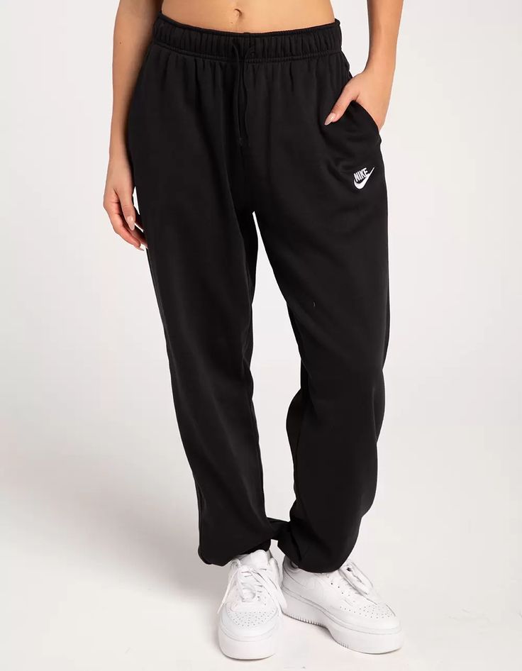 NIKE Sportswear Club Womens Oversized Fleece Sweatpants - BLACK | Tillys Nike Cuffed Sweatpants Women, Black Nike Sweat Pants, Black Nike Sweatpants Outfits Women, Nike Sweat Pants Outfit Women, Black Sweatpants Women, Nike Sweatpants With Elastic Waistband For Loungewear, Nike Comfortable Sweats With Elastic Waistband, Comfortable Nike Sweats With Elastic Waistband, Nike Fleece Sweats With Elastic Waistband