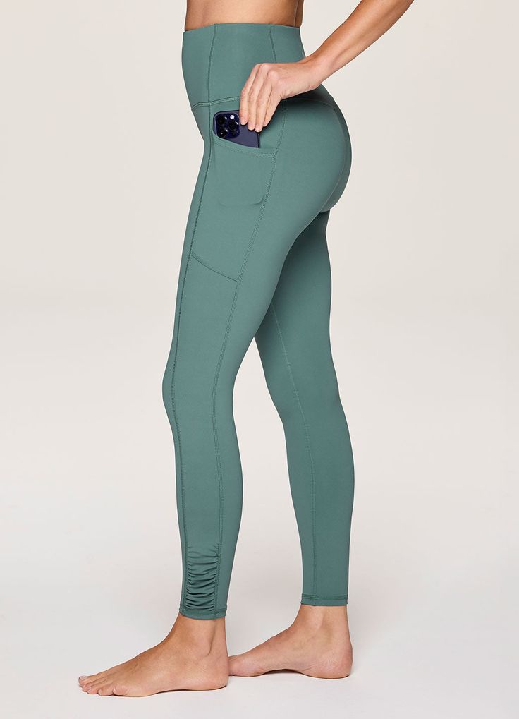 Take on your active lifestyle with ease and style with our In Renewal Ruched Legging. Constructed from our smooth, quick-drying Tech Flex fabric with four-way stretch, these full length, moisture wicking leggings provide light compression and full range of motion while maintaining the squat-proof properties you're looking for. Large side pockets conveniently hold all of your essentials, and a seamless high rise waistband offers both a supportive and flattering fit. Complete with side ruching det Solid Go-dry Elastane Activewear, Moisture-wicking Solid Color Elastane Activewear, Green 4-way Stretch Sportswear Yoga Pants, Moisture-wicking Elastane Activewear, Breathable Full Length Functional Activewear, Functional Full-length Breathable Yoga Pants, Solid Color Moisture-wicking Sports Leggings, Nylon Full Length Sportswear Activewear, Full Length Nylon Sportswear Activewear