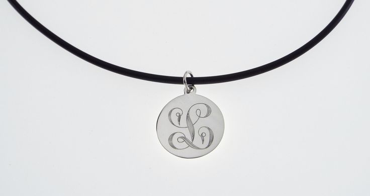 "This elegant necklace is sure to bring you many compliments ! I will carefully engrave a single, beautifully ornate script initial on this high polish 7/8\" diameter sterling silver disc. Take a look at the last picture - I have engraved a sample of each letter, so you can see what yours will look like! This lovely necklace is suitable for every day wear or formal events. The finished piece will be suspended on your choice of: *16\" rubber cord with stainless steel lobster clasp or *18\" rubber Etched Sterling Silver Round Disc Jewelry, Etched Necklaces For Anniversary, Etched Round Disc Jewelry As Gift, Etched Necklace For Anniversary, Etched Round Necklace For Anniversary, Elegant Etched Round Disc Necklace, Etched White Gold Round Pendant Necklace, White Gold Etched Round Pendant Necklace, Etched Medallion Necklace For Anniversary