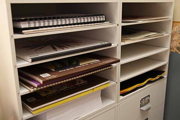 a filing cabinet with many files and folders