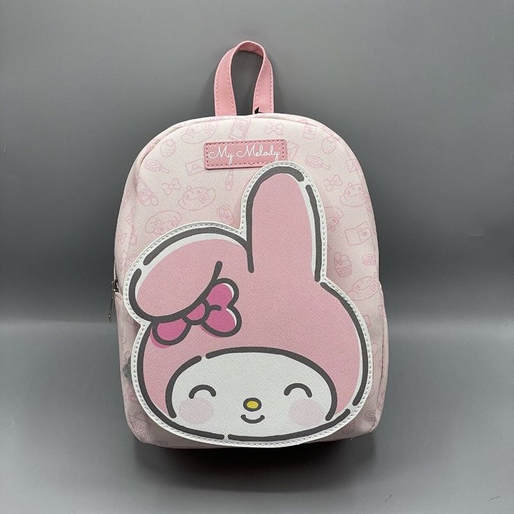 My Melody Figural Pocket Mini Backpack Get Excited For A My Melody Mini Backpack For Your Collection! This Style Features A Figural Front Pocket Showing My Melody Smiling. The Rest Of The Backpack Has An Allover Print Of Treats, My Melody's Face And A Cellphone. Interior Zippered Pocket And Adjustable Straps. * 9" X 4" X 11" * Polyurethane * Imported Kawaii Softback Bags For Everyday Use, Cute Travel Backpack With Adjustable Strap, Cute Softback Travel Bags, Kawaii Softback Backpack For Everyday Use, Kawaii Style Softback Backpack For Everyday Use, Cute Standard Backpack With Adjustable Strap, Cute Standard Portable Backpack, Cute Everyday Standard Backpack, Cute Portable Standard Backpack