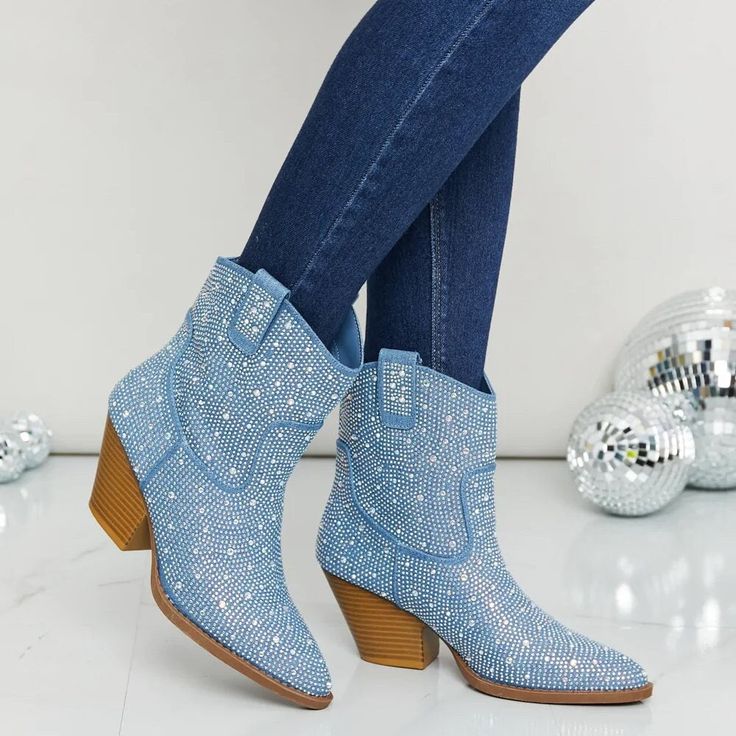 "These western cowboy inspired boots feature a pointy toe and stacked heel. The rhinestone adds a multi-faceted finish and flair to a classic bootie. ♥ PU/High quality vegan leather, Rhinestones ♥ Heel Height: Approx. 3\" SHIPPING ✦ Orders will be shipped within 1-2 business days (unless otherwise specified). ✦ Shipping is FREE within the US (domestic) via USPS and usually takes approx. 2-5 business days. ✦ If you need express shipping for rush orders, please contact us! We would be more than happy to help you." Low Heel Denim Ankle Boots, Blue Cowboy Boots Ankle, Western Ankle Boots Metallic, Denim Low Heal Boots, Luxury Ankle Cowboy Boots For Winter, Western Boots With Rhinestone Rivets For Winter, Western Winter Boots With Rhinestone Rivets, Western Rhinestone Boots With Round Toe, Western Boots With Rhinestones And Round Toe