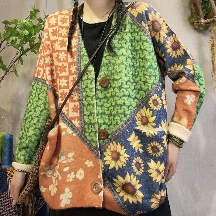 Check out our Floral Knitted Loose Cardigan! Made with a soft, warm material, this cardigan will keep you comfortable all season long. It features a V-neck design and long sleeves, making it perfect for layering over your favorite outfits. Plus, the bright colors are sure to add a touch of happiness to your wardrobe. Whether you're dressing up for a special occasion or just heading out for a casual day, this cardigan is a great choice. Green Knit Long Sleeve Outerwear, Cozy Multicolor V-neck Cardigan, Green Knitted Outerwear For Layering, Casual Multicolor V-neck Cardigan, Green Cotton Long Sleeve Cardigan, Casual Multicolor Cardigan For Layering, V-neck Soft Knit Sweater Coat For Spring, Green Knit V-neck Outerwear, Green Long Sleeve Cardigan