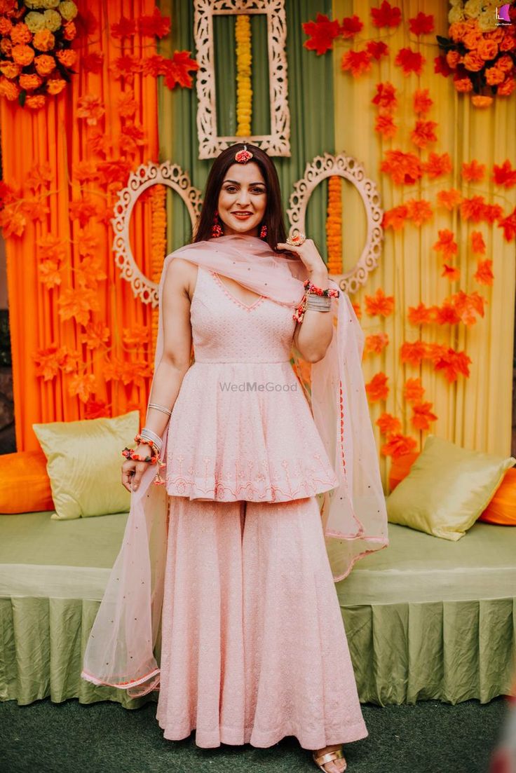 Photo of sharara with peplum kurta for mehendi in light pink Peplon Tops With Sharara, Pink Plazo With Top, Peplum Plazo Suit, Embroidery Sharara Designs, Peplum Suit With Sharara, Peplum Dress Wedding Indian, Peplum Kurti With Plazo, Peplum Top Outfits Indian With Sharara, Peplum Suits Indian