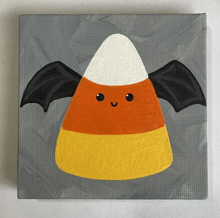 an acrylic painting of a candy corn with bat wings on it's head